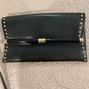 DVF black clutch with gold detail studs